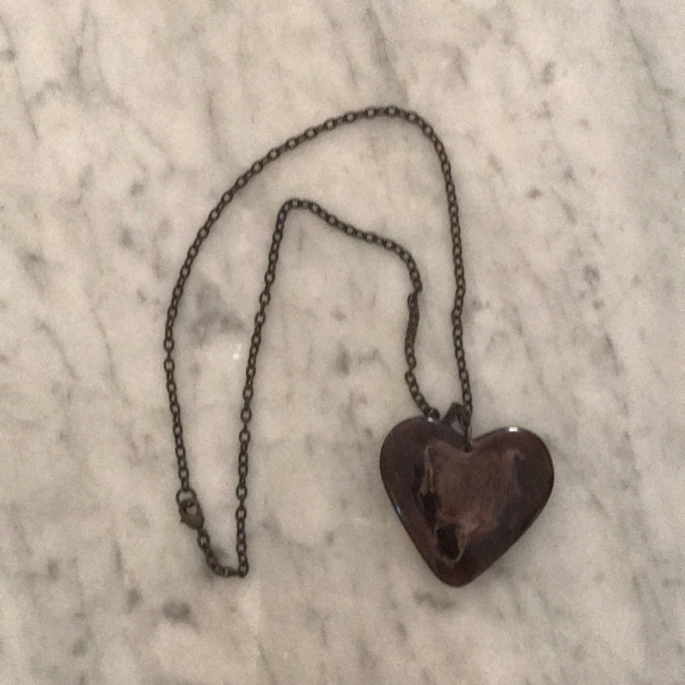 Heart shaped pendant necklace with marble effect.